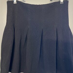Maeve Textured Black Mini Skirt size 6. Back zip, textured, pleats.